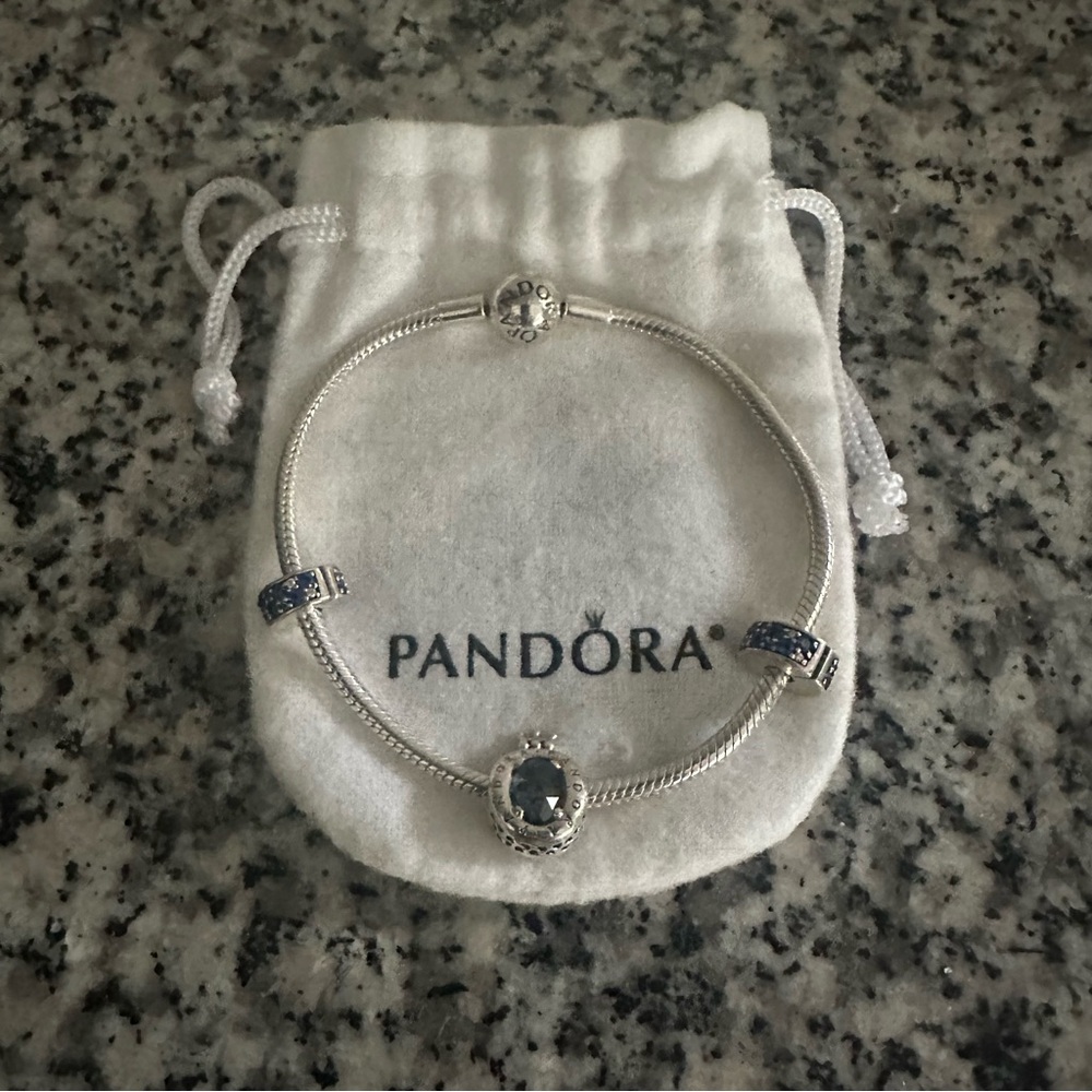Authentic Pandora silver bracelet with blue charms.